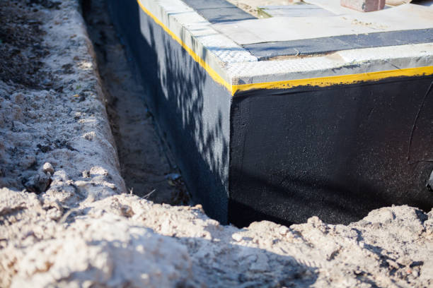 Professional Waterproofing technician working in Goshen, IN